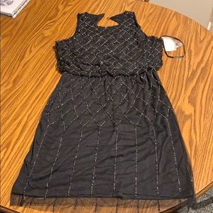 Black dress with black and white breading